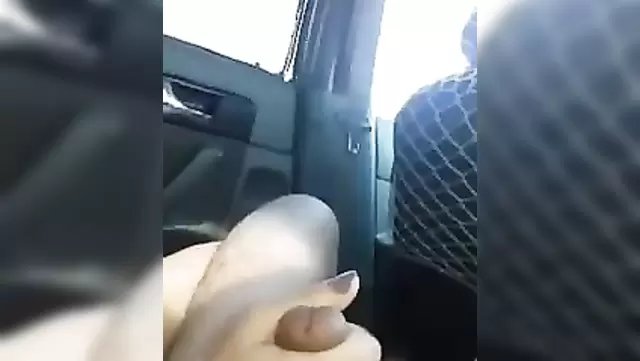 Uzbek wife gives a handjob to her husband in the car